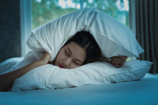 Woman struggling to find the motivation to get out of bed