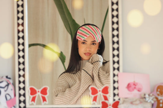 Woman wearing a SMUG 'sweet shop' satin sleep mask