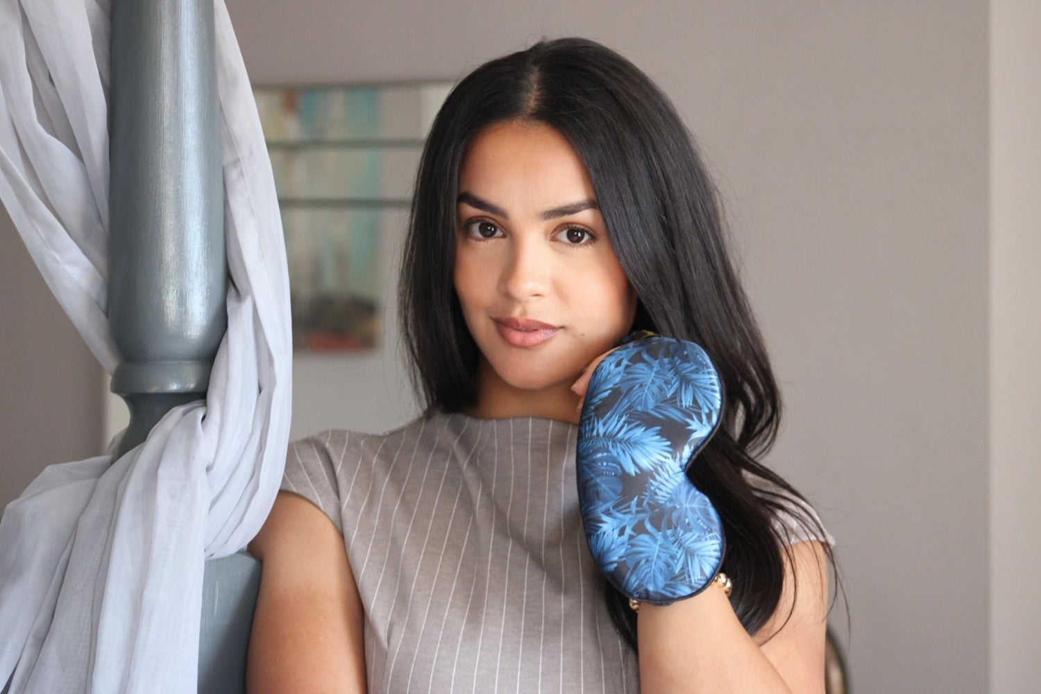 Woman holding Smug Contoured Sleep Mask