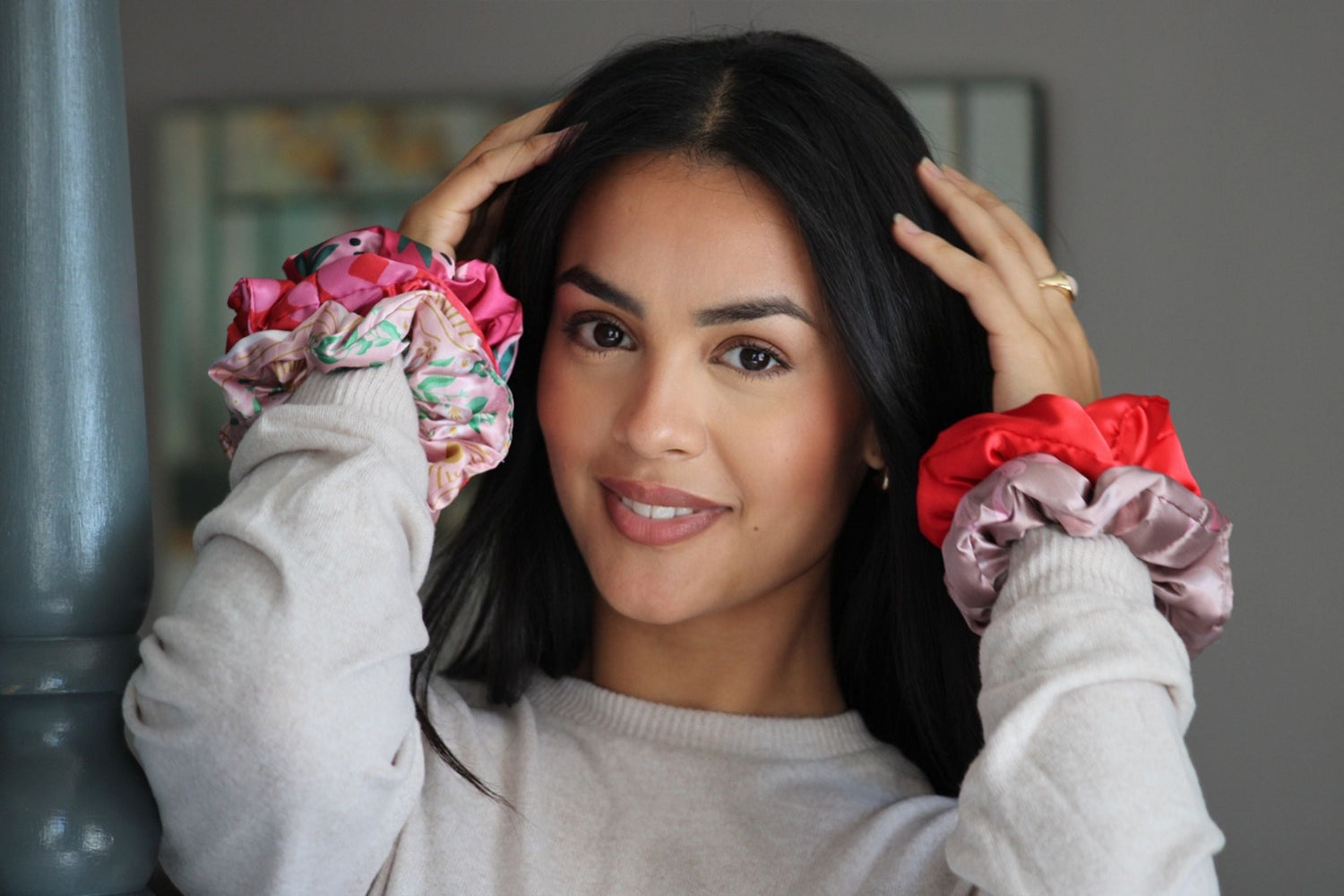 Woman wearing multiple smug hair scrunchies